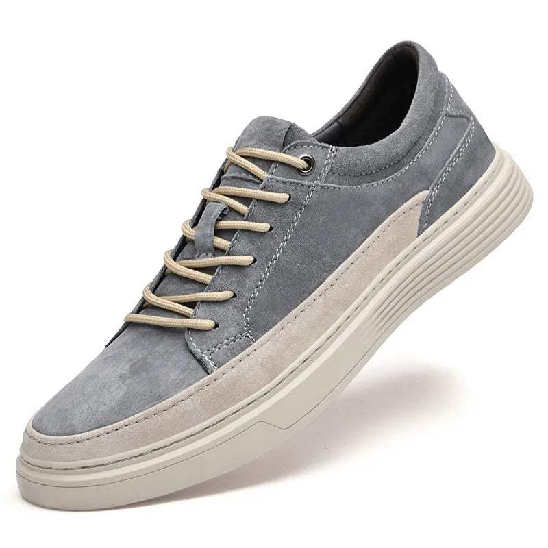 Men's grey casual leather skate shoes with round toe and lace-up front.