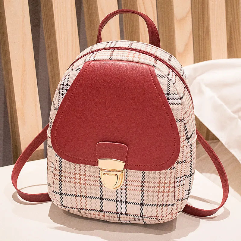 Diagonal shoulder phone bag in PU leather shown in one of five colours: black, blue, brown, pink, or red.