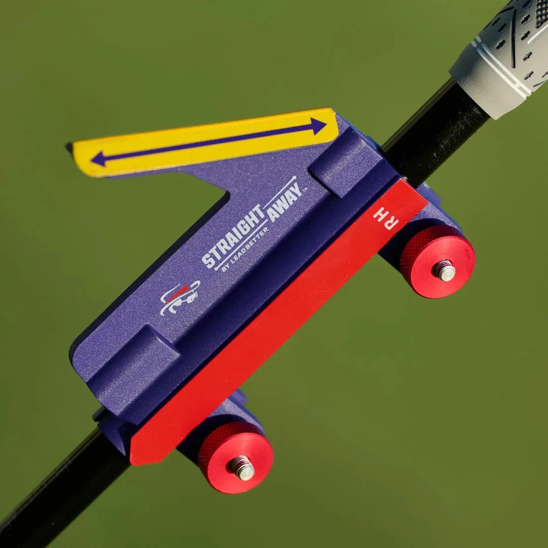 Plastic golf swing plane simulator trainer on practice surface