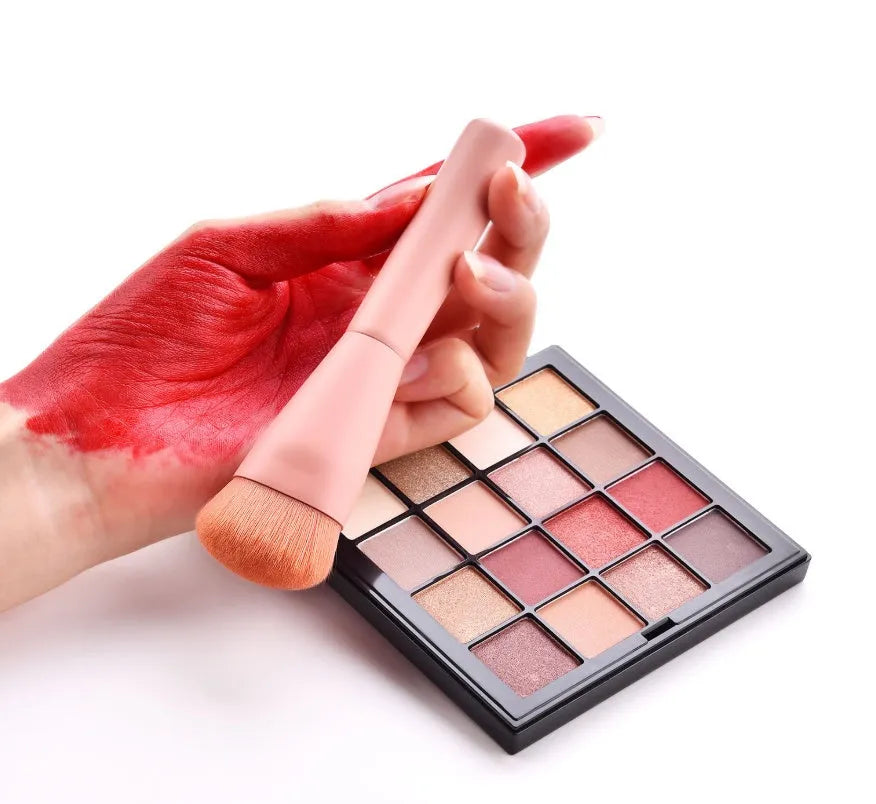 Ten professional makeup brushes with wooden handles arranged in a set, including powder, foundation and detail brushes