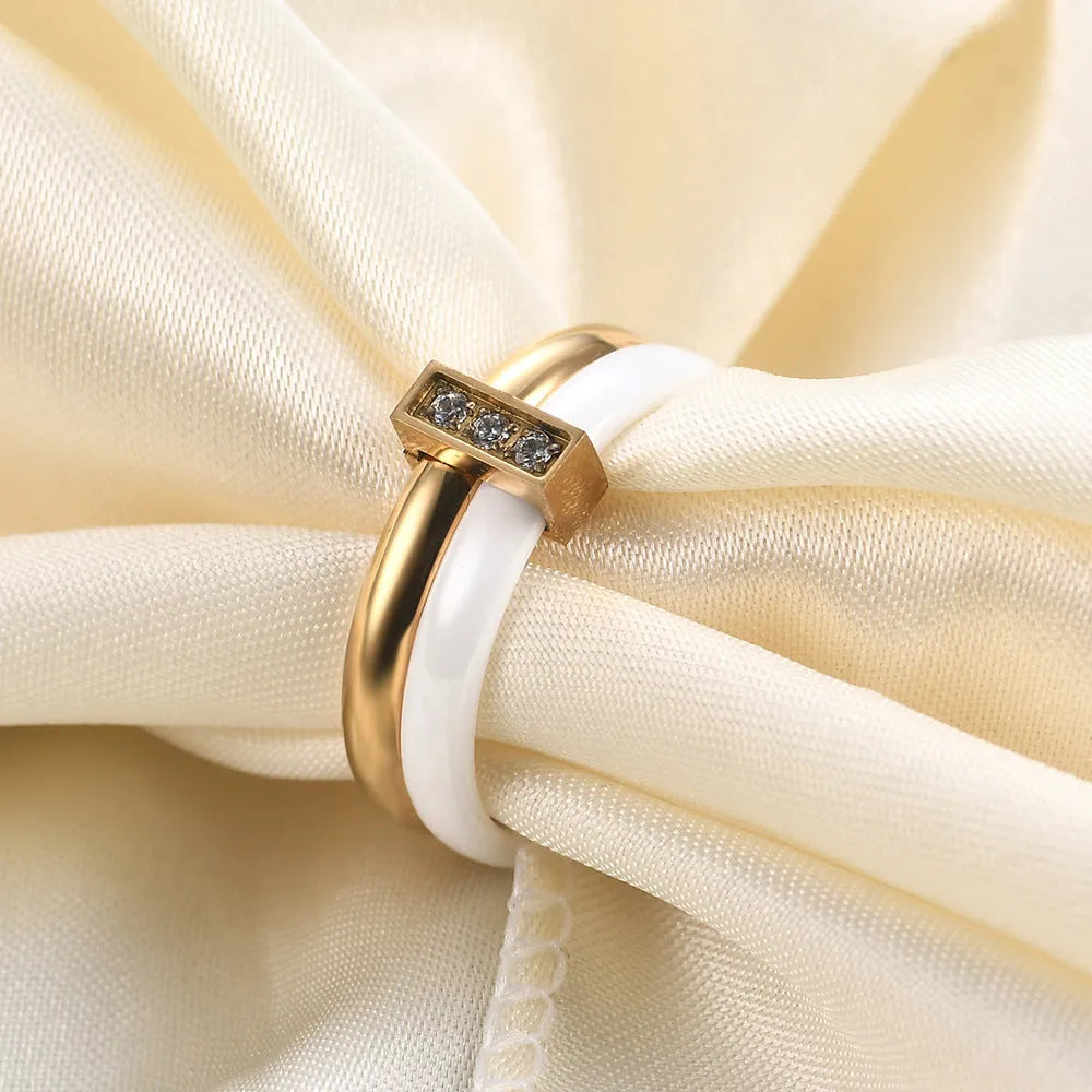 Glossy ceramic women's ring with geometric shape and stitching detail in steel black or gold white finish