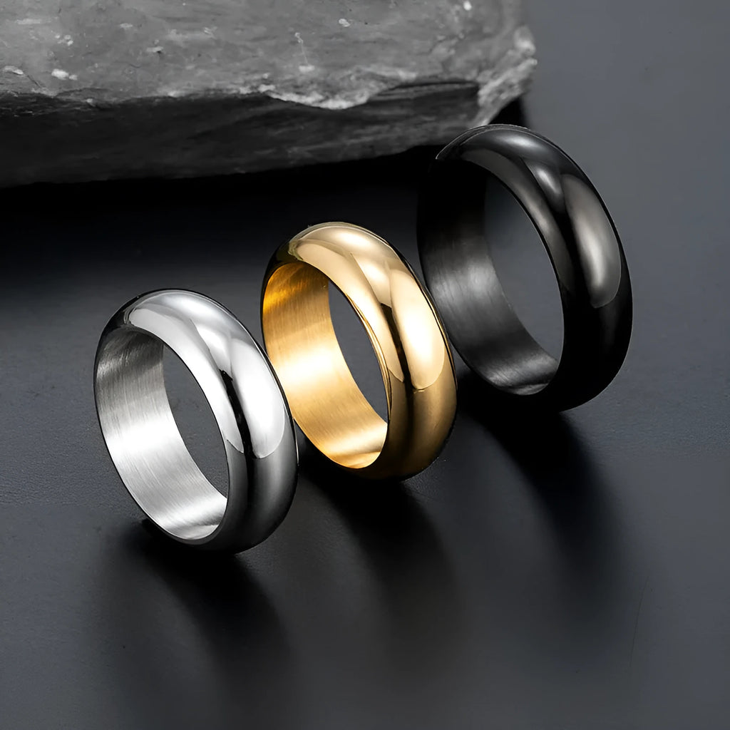 Glossy electroplated titanium steel ring shown in gold, black, and steel colour options on a plain background.