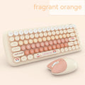 Pink wireless keyboard and mouse set with compact design for desk use