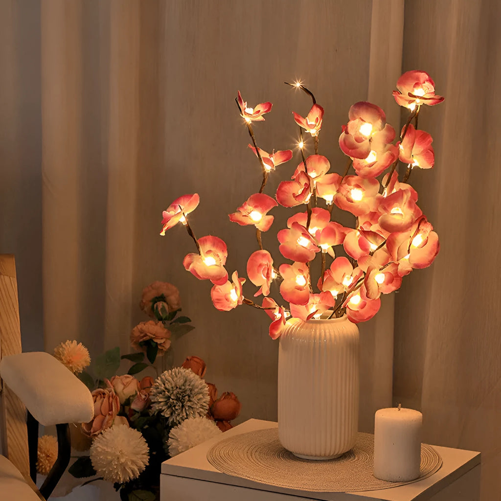 Pink LED phalaenopsis orchid branch decorative light with warm white LEDs on a 65cm stem.