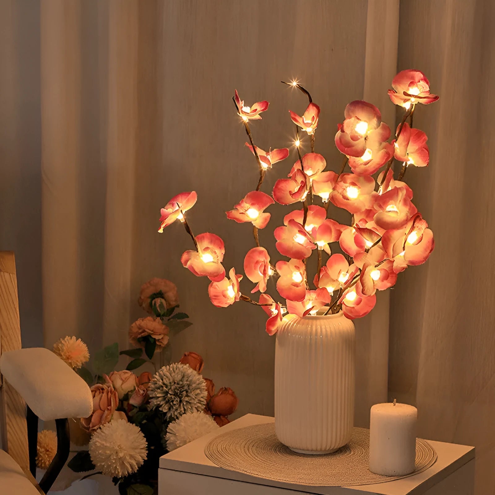 Pink LED phalaenopsis orchid branch decorative light with warm white LEDs on a 65cm stem.