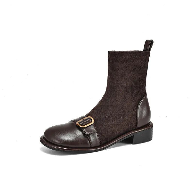 Women's black casual Martin-style ankle boots with buckle stitching and front lace-up on a low rubber sole.