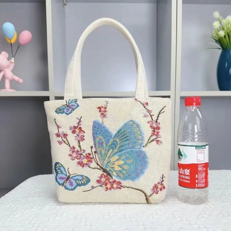 Double-sided gold wire embroidered canvas tote bag showing front and back design, available in multiple sizes and colours.