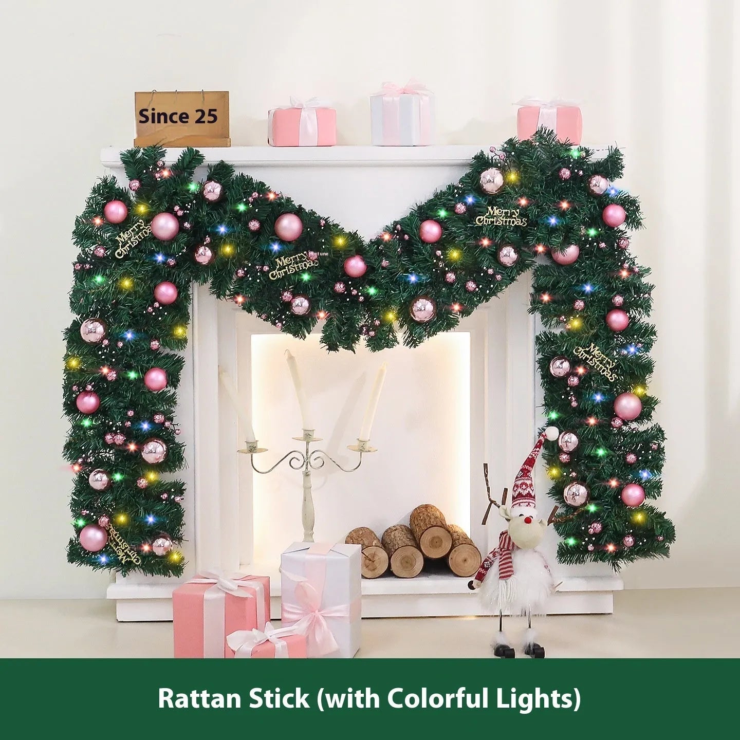 Pink artificial Christmas rattan garland with small berries and warm white LED lights draped on a mantelpiece.