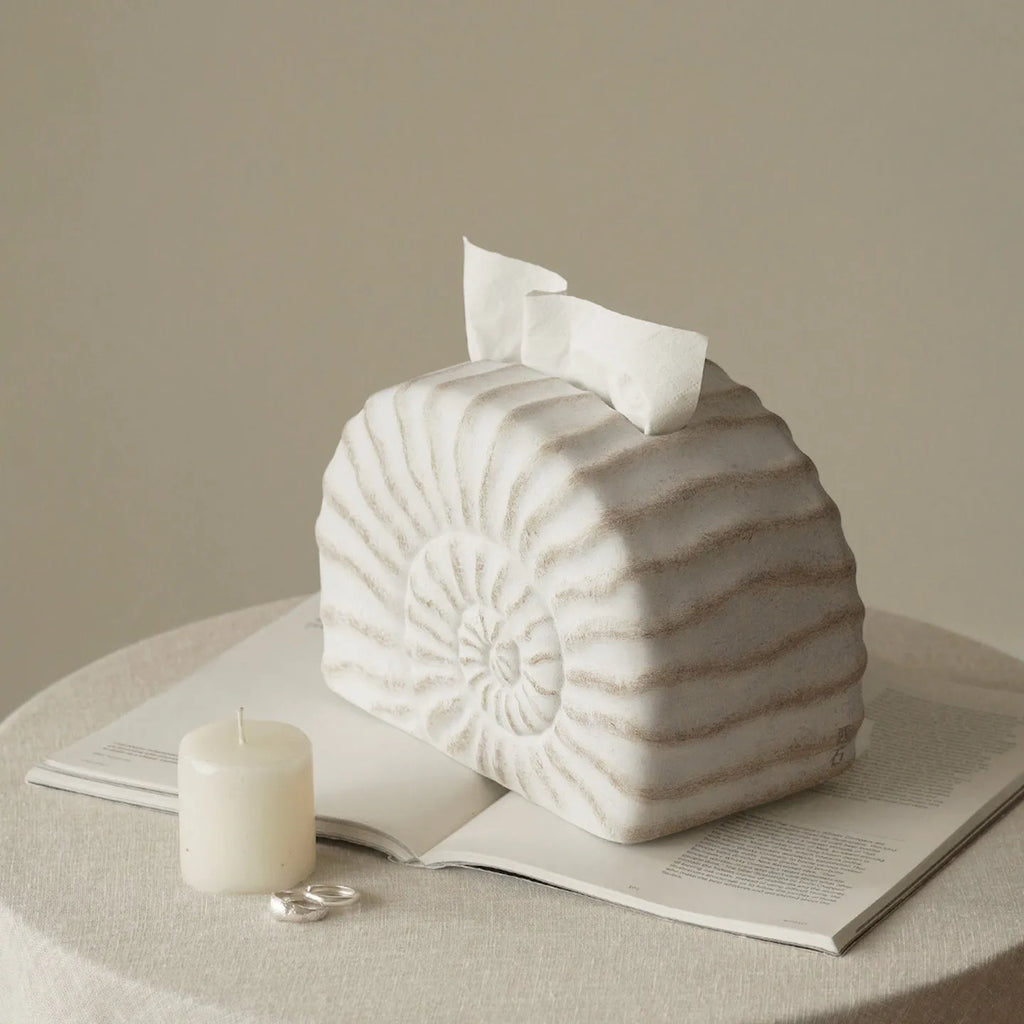 Modern simple resin tissue box cover with decorative conch ramble pattern.