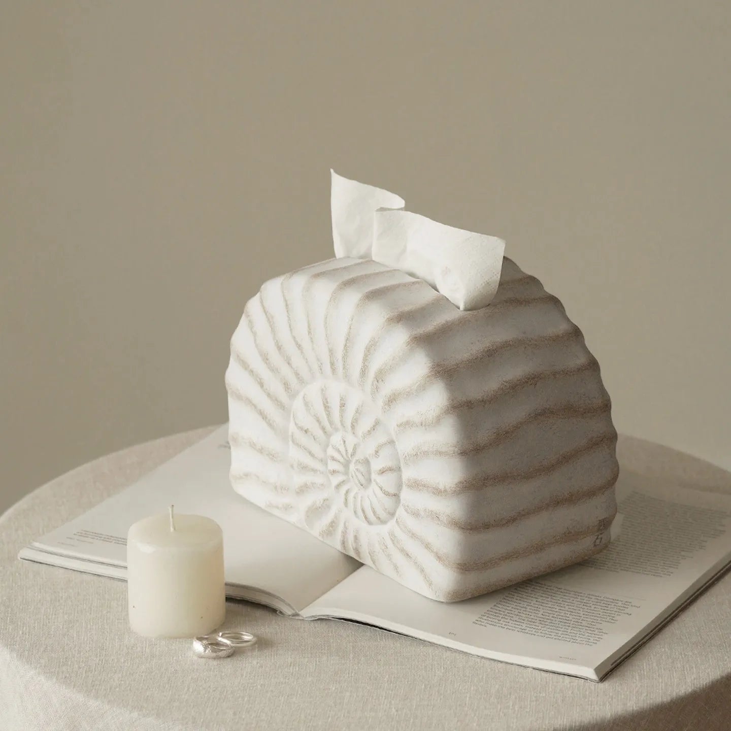 Modern simple resin tissue box cover with decorative conch ramble pattern.