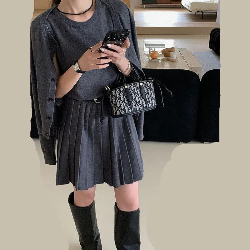 Women's grey Art Retro knitted vest skirt and long-sleeved cardigan two-piece set with pleated detail.