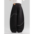 Black straight-leg denim trousers with mid-waist zip fly design on hanger