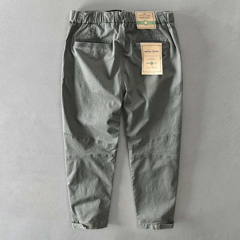Men's khaki cotton casual overalls with elastic waistband and loose leg fit.