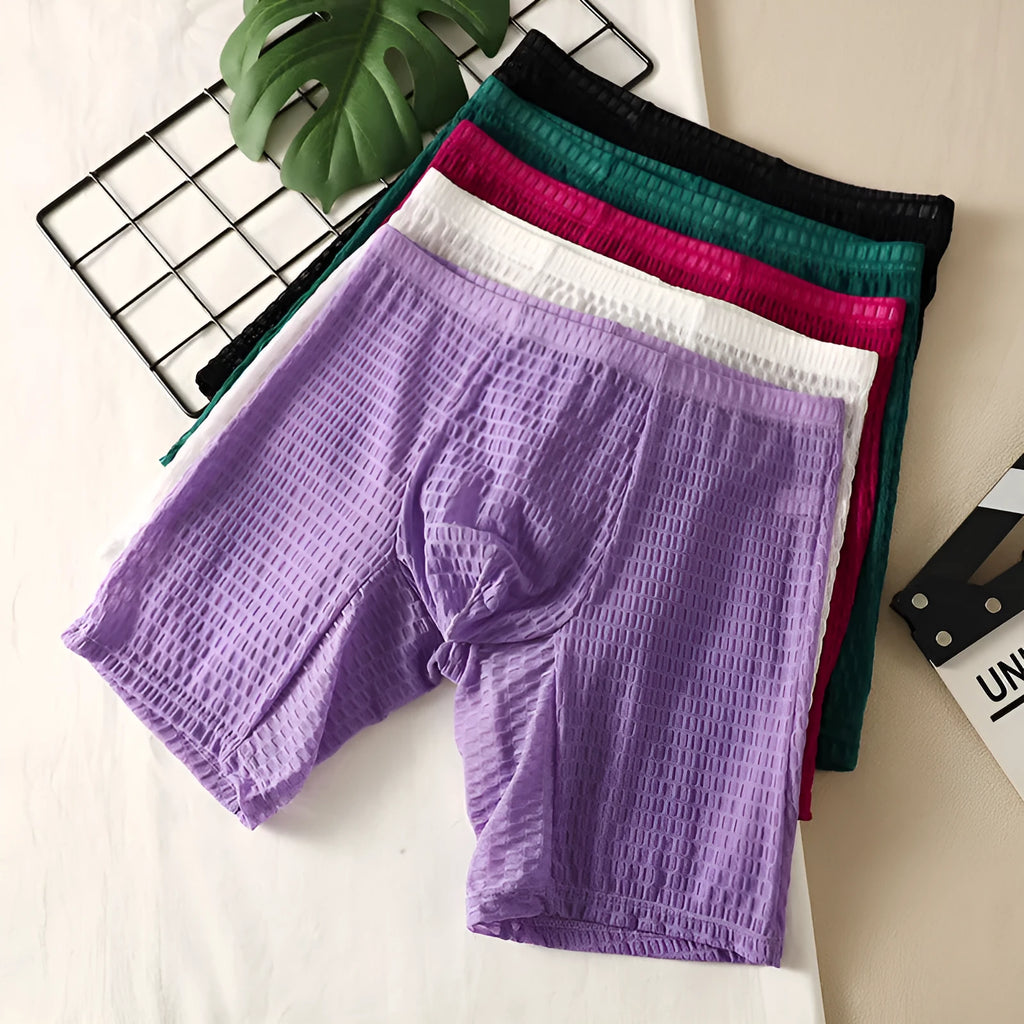 Men's solid colour lace boxer shorts with a hip-lifting fit on a size chart.