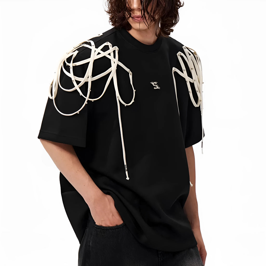Black loose-fit short-sleeved T-shirt with padded shoulders and rivet ribbon detail.