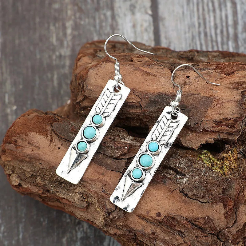 Silver geometric earrings with turquoise inlay in long strip retro design