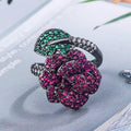 Women's black gold geometric ring with gold-plated red corundum flower detail