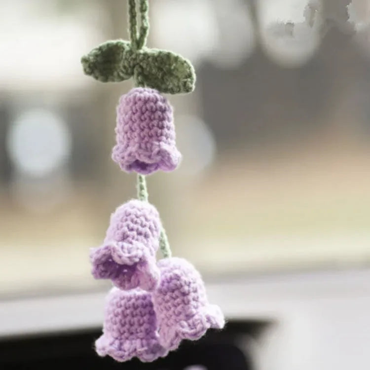 Knitted green and white car plant decoration with hanging rope