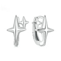 Sterling silver ear clips with minimalist star design and oxidation finish.