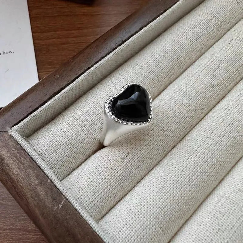 Adjustable sterling silver ring with heart-shaped black agate stone and open mouth design