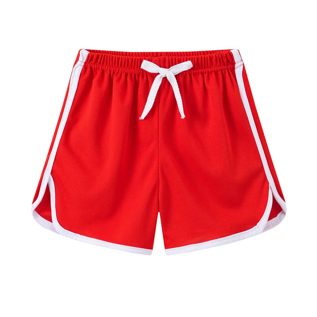 Children's polyester beach shorts in various colors and patterns including pineapple and kitten designs for sizes 100 to 140