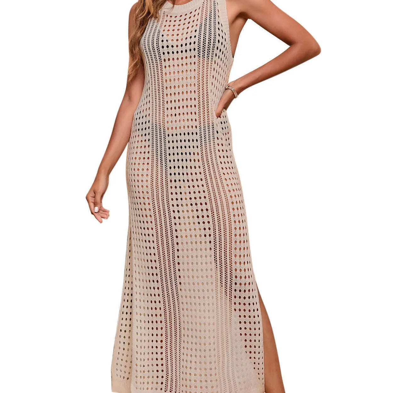 Women's loose knitted beach blouse in a solid colour with a hollow-out design.