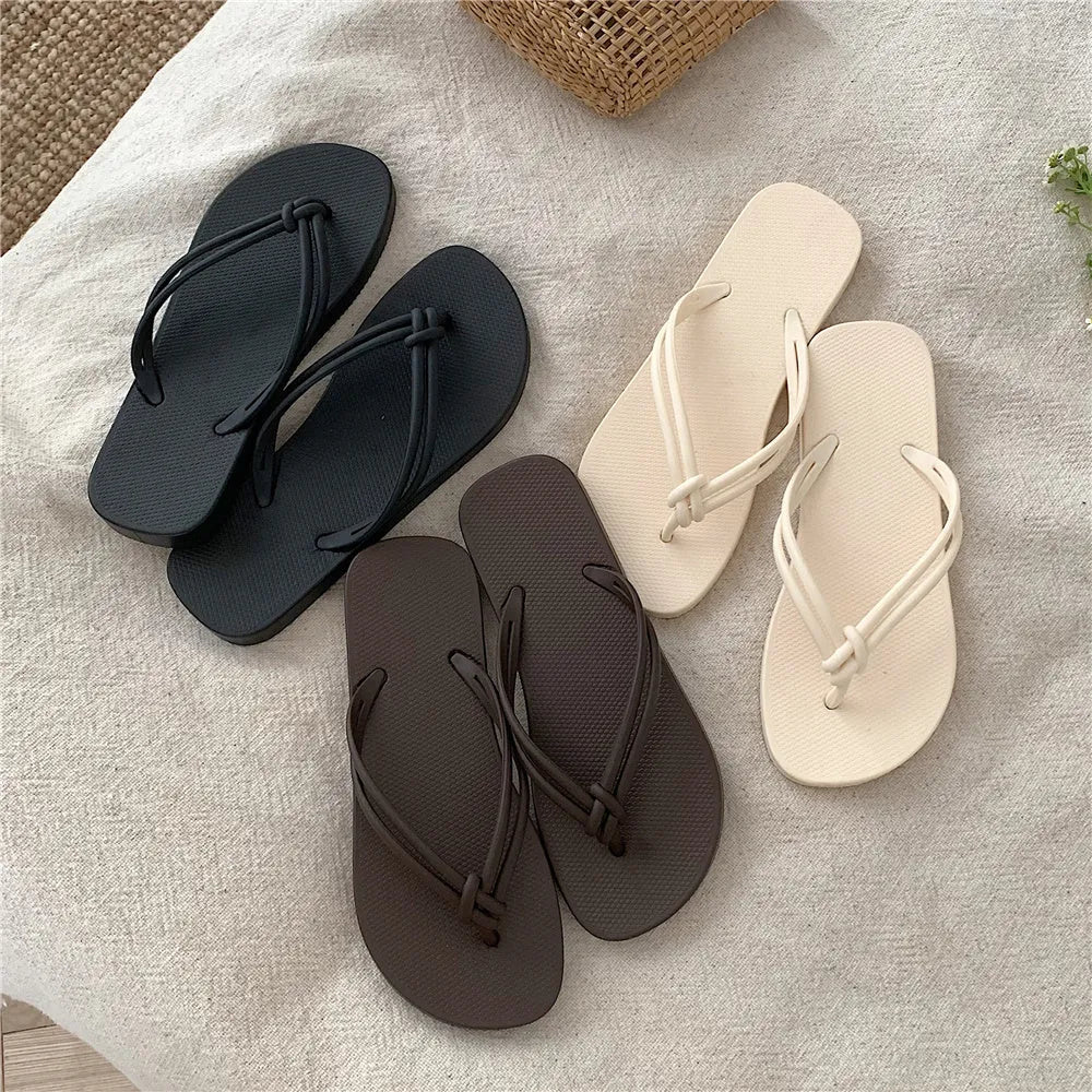 Men's casual flip flops with toe covering in PVC material, showing non-slip sole pattern and full foot enclosure design