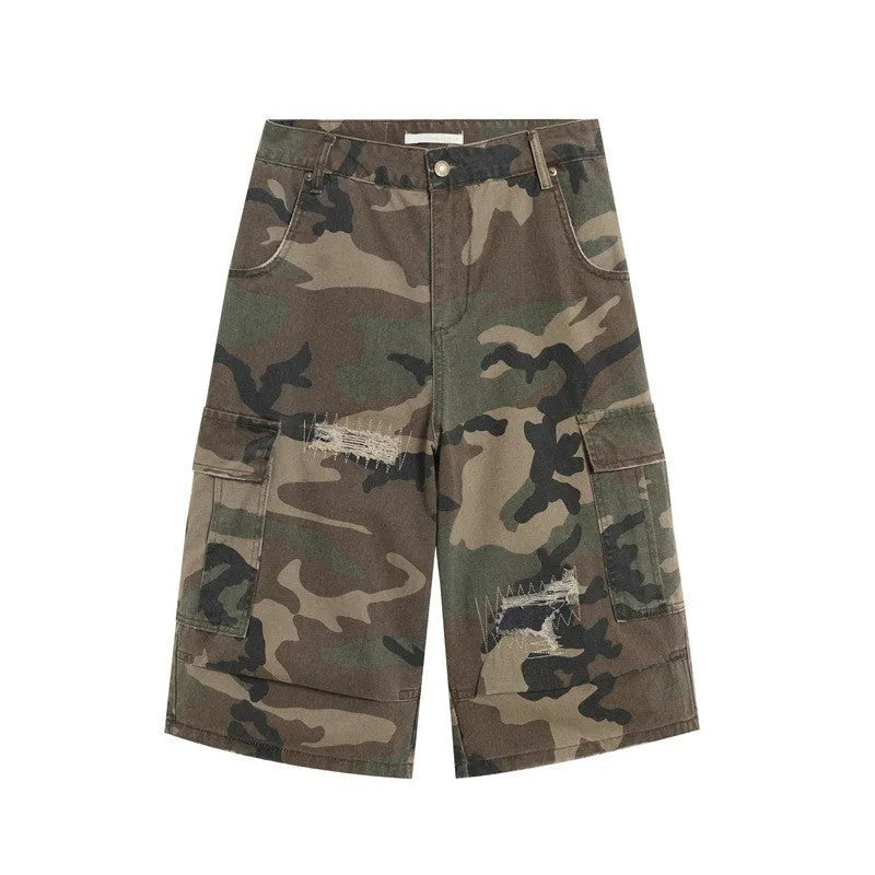 Men's straight-leg cropped jeans in camouflage pattern with patchwork detailing and distressed rips