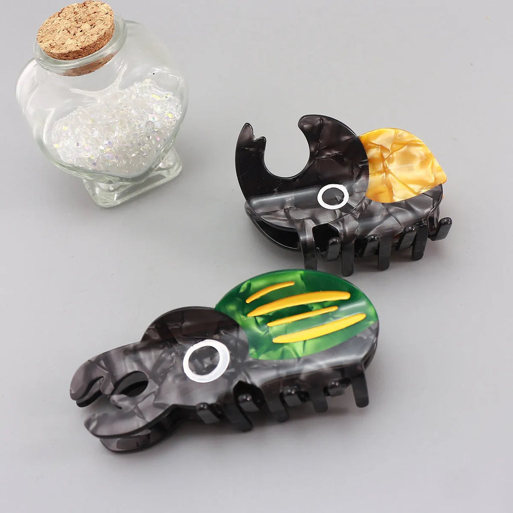 Handmade cellulose acetate Beetle Grip with cartoon caterpillar design in green or orange beetle colours