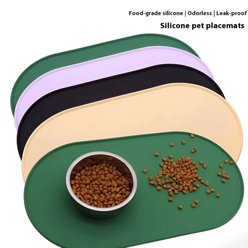 Green silicone waterproof placemat for cat bowls on a wooden floor