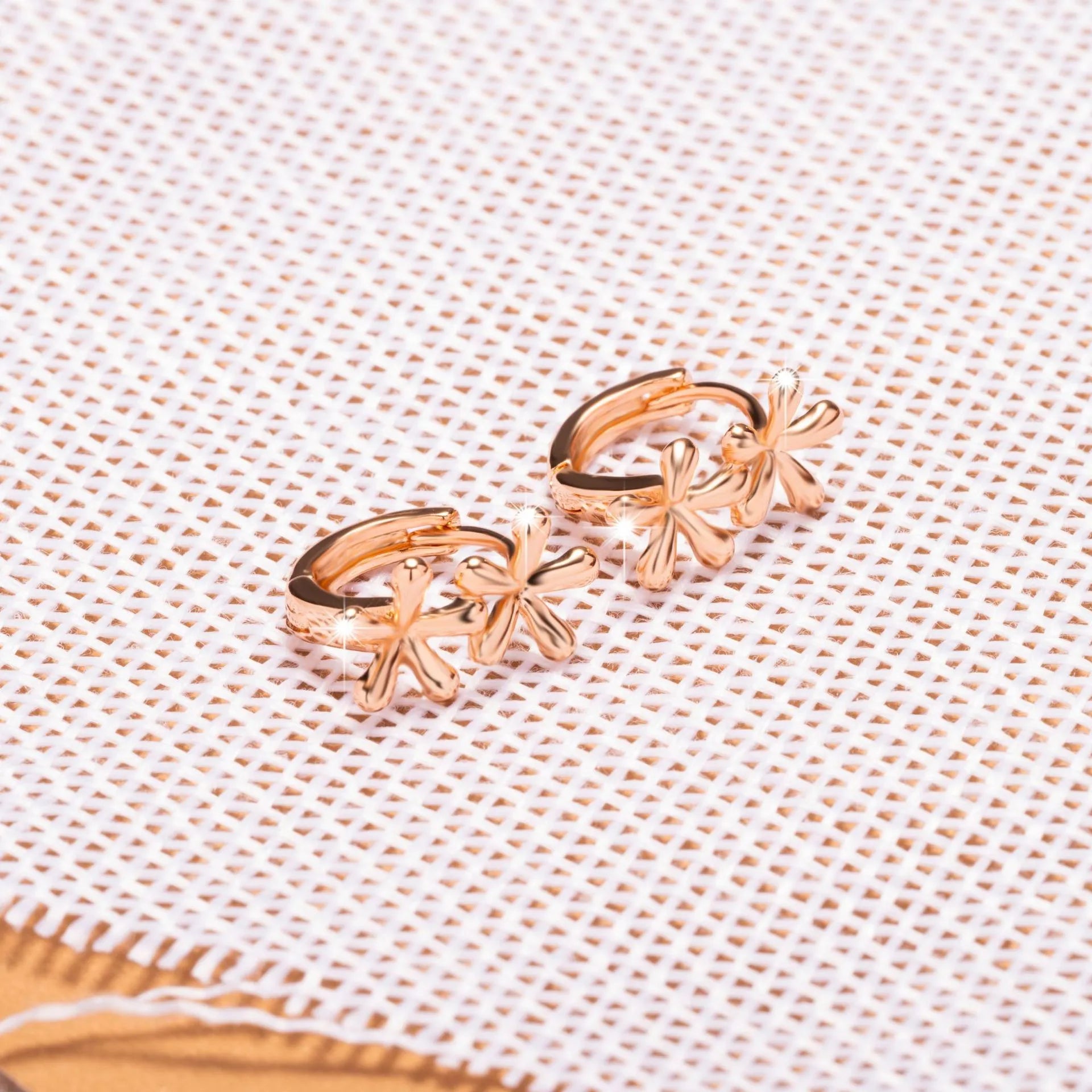 Circular rose gold waterdrop flower earrings with electroplating finish