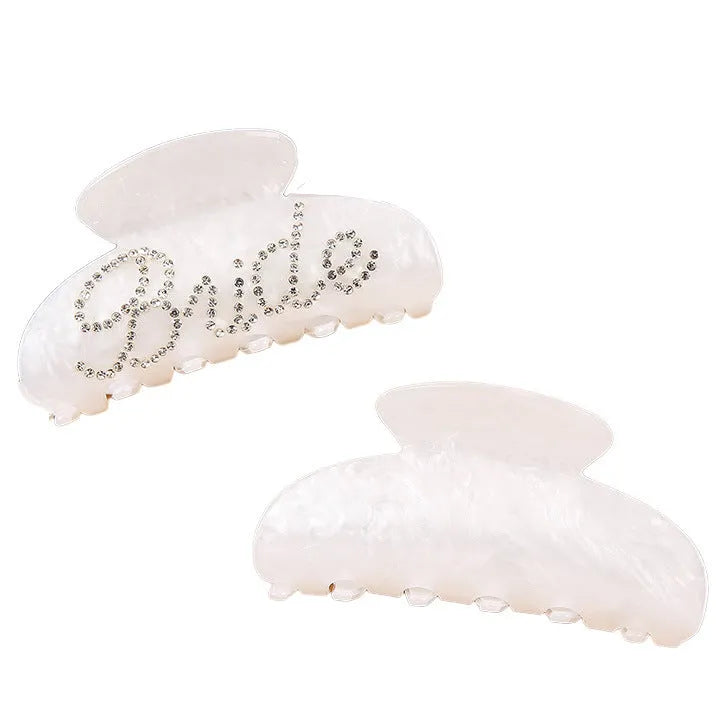Pink and white acrylic shark clip hair barrettes with spot drill decoration on a sweet style