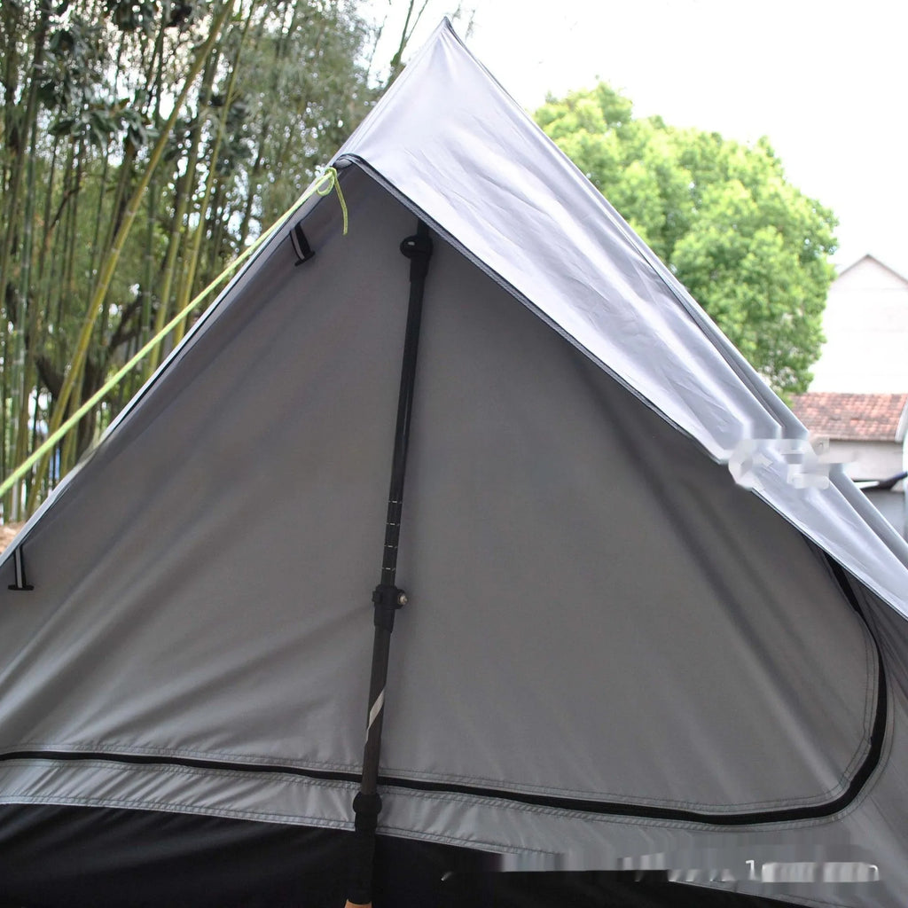 Brown A-line cabin tent setup with hiking pole supports showing spacious interior and waterproof fabric construction