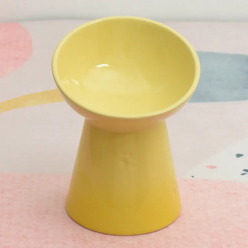 High-foot ceramic pet bowl with chin protector and anti-tumble base design