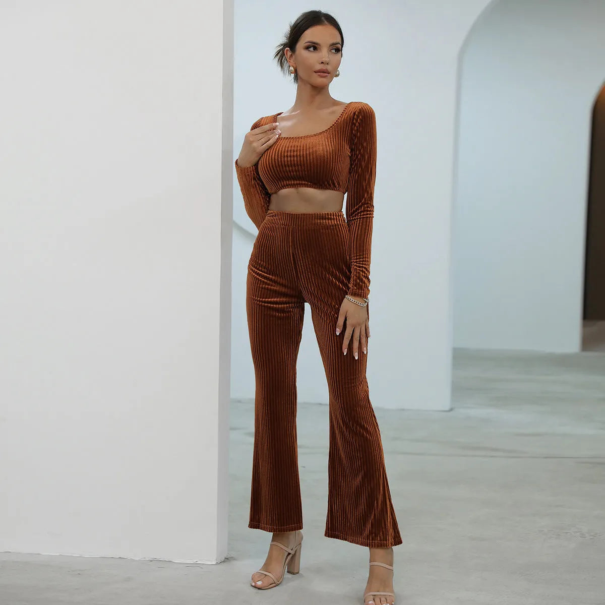 Caramel coloured long sleeve sweater set with matching trousers on hanger
