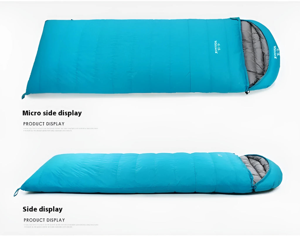 Black outdoor sleeping bag with envelope structure and goose down fill on a campsite.