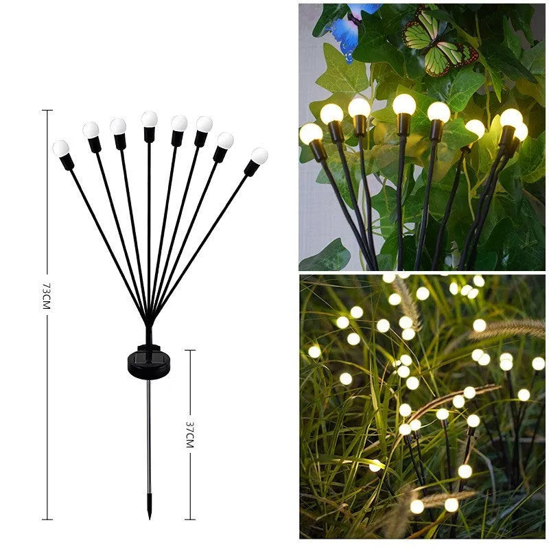 Solar-powered LED firefly garden spike light with stainless steel ground stake illuminated at dusk.