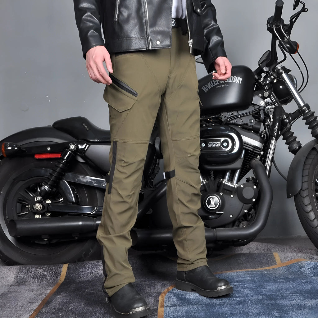 Men's black waterproof motorcycle pants with belt and protective gear set on a neutral background.