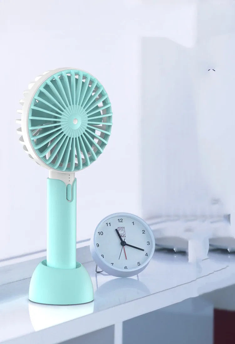 Blue portable USB handheld desktop fan with three-speed control and figure-8 oscillation