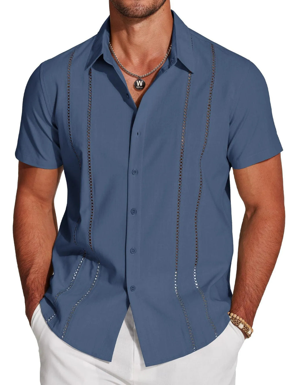 Man wearing a slim fit digital print Hawaiian short sleeve shirt in a casual setting