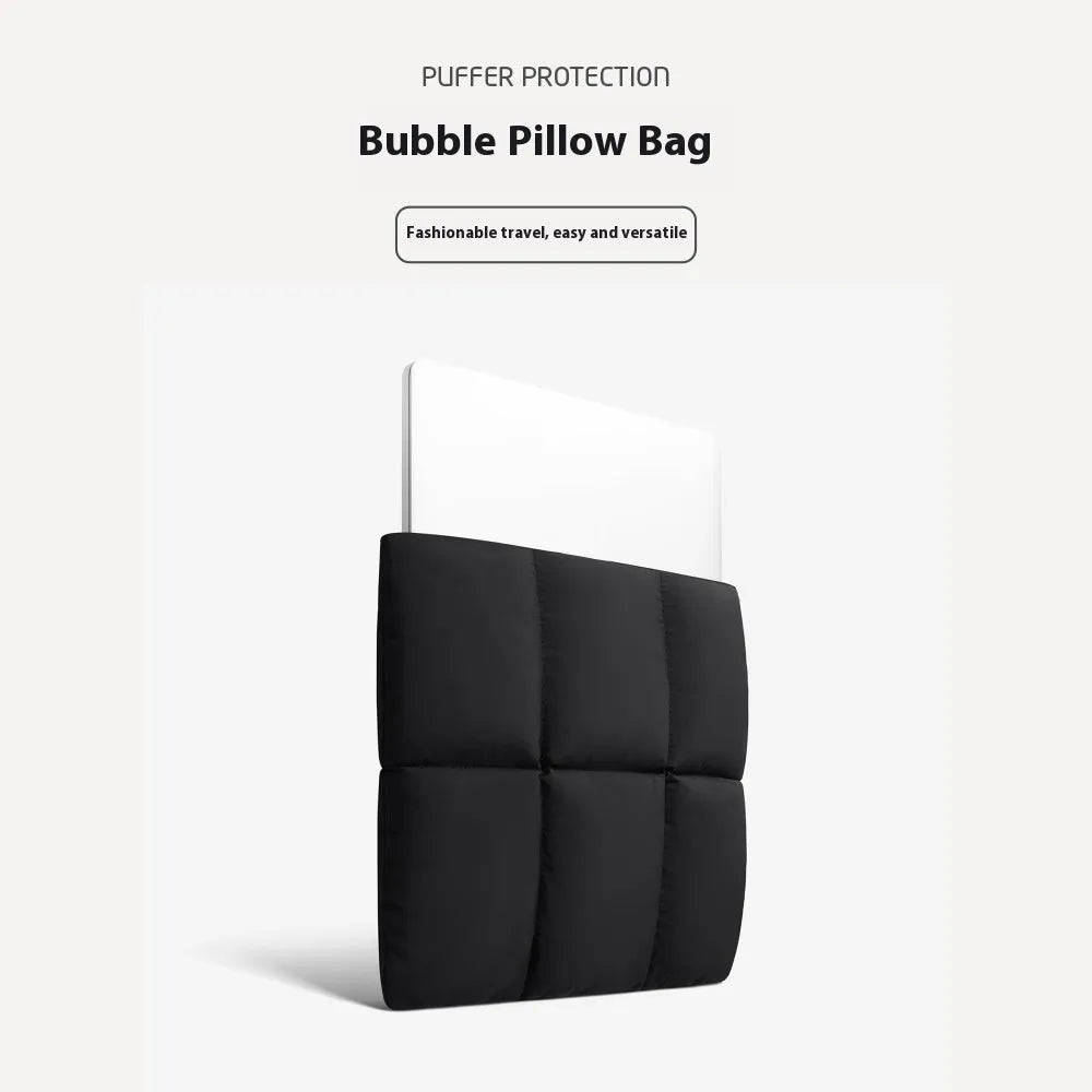 Soft black polyester laptop sleeve for a 15.6-inch laptop on a table.