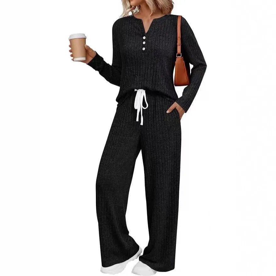 Women's striped knitted long coat with V-neck, long sleeves, lace-up detail, and side pockets.