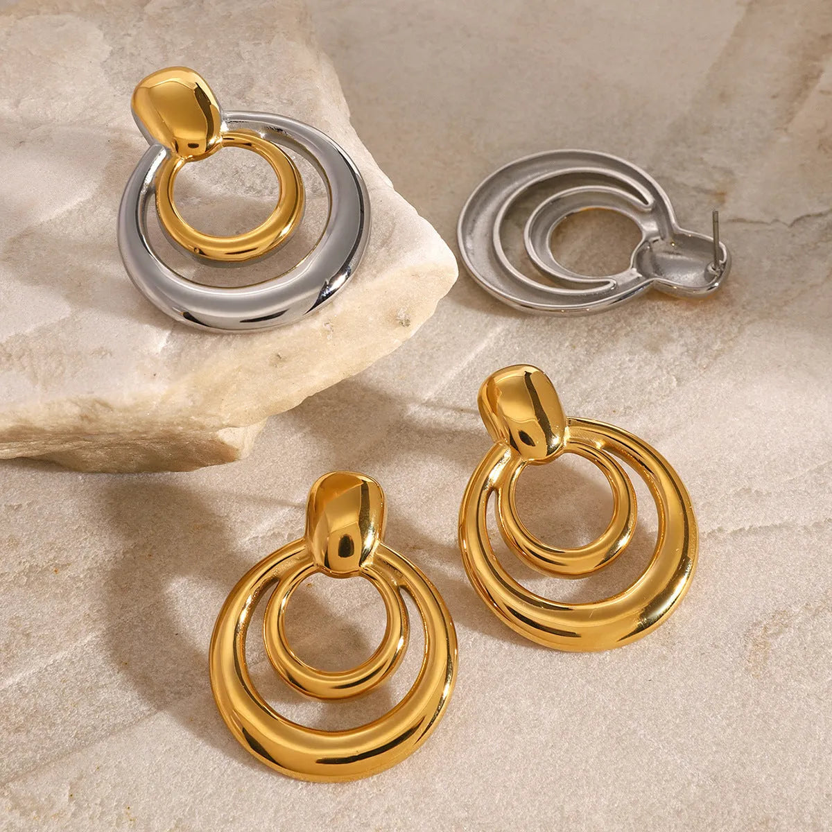 Golden round double layer hollow stud earrings with geometric design