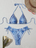 Women's denim blue printed bikini set with adjustable straps, shown as a two-piece swimsuit.