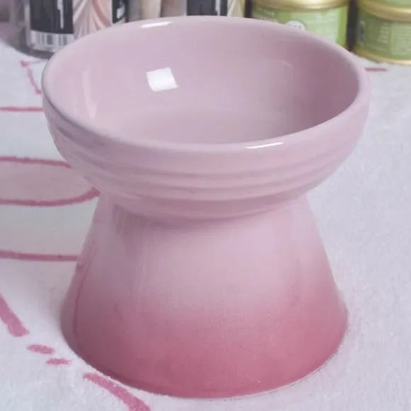 High-foot ceramic pet bowl with chin protector and anti-tumble base design
