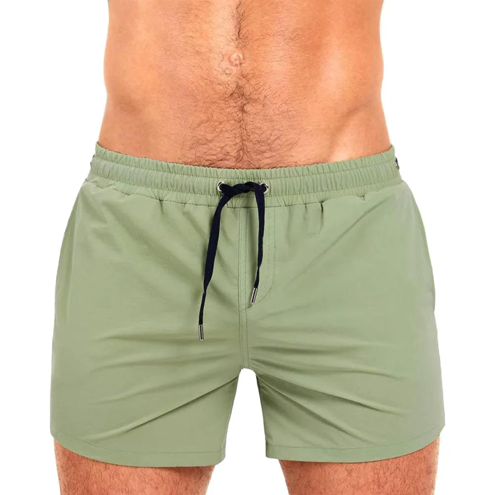 Mesh-lined sports shorts in polyester fabric with elastic waistband available in multiple colours
