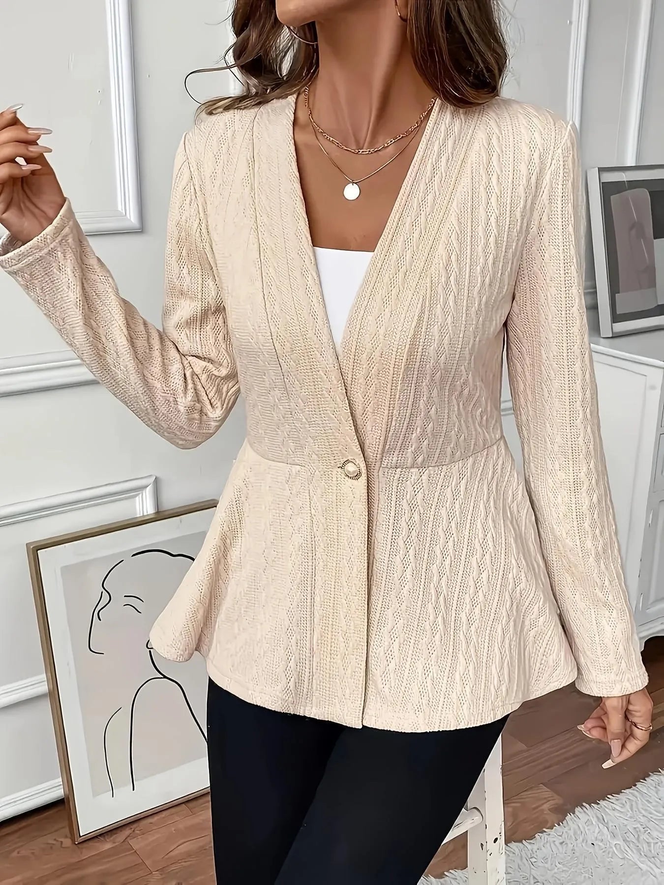 Women's apricot knitted cardigan with one button and jacquard texture on hanger