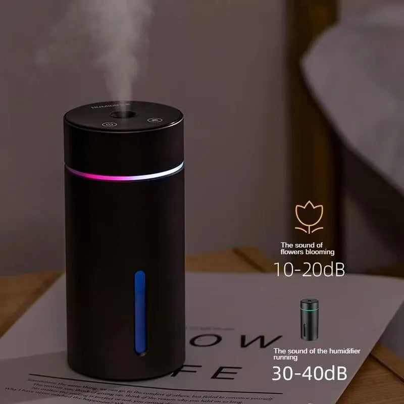 Black aluminium portable car air humidifier and essential oil diffuser unit with USB cable.