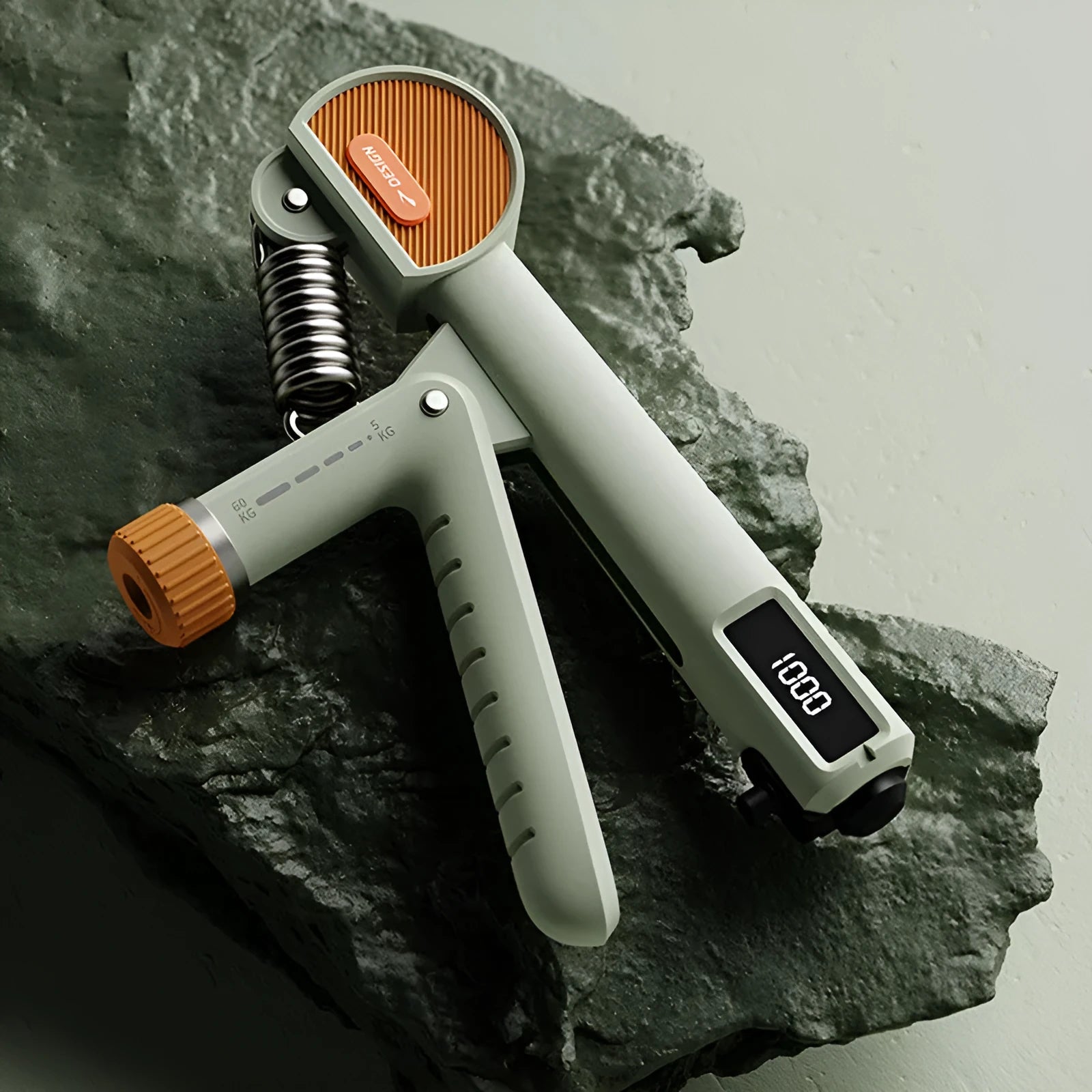 Adjustable spring hand grip trainer showing three resistance springs and ergonomic ABS plastic handles
