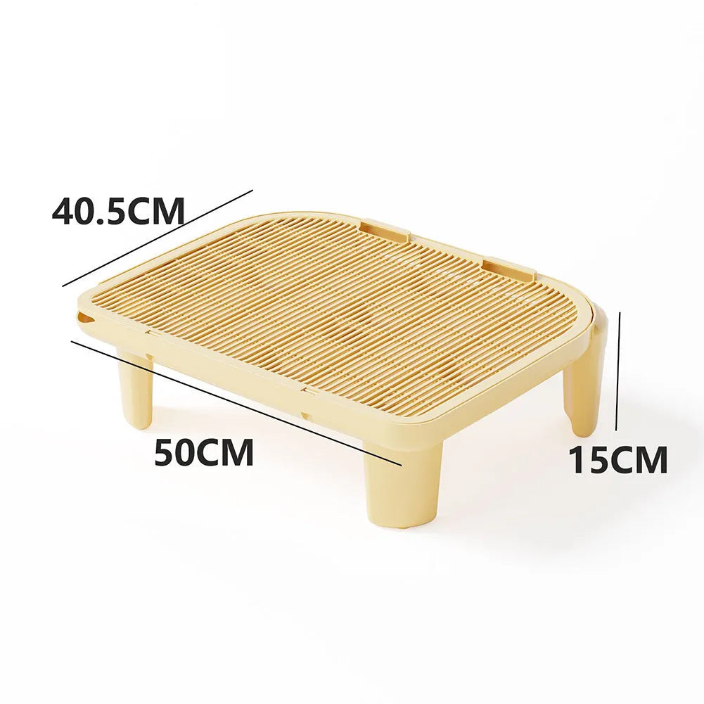 Milk yellow plastic cat litter mat with anti-slip silicone feet measuring 40 x 40.5 cm